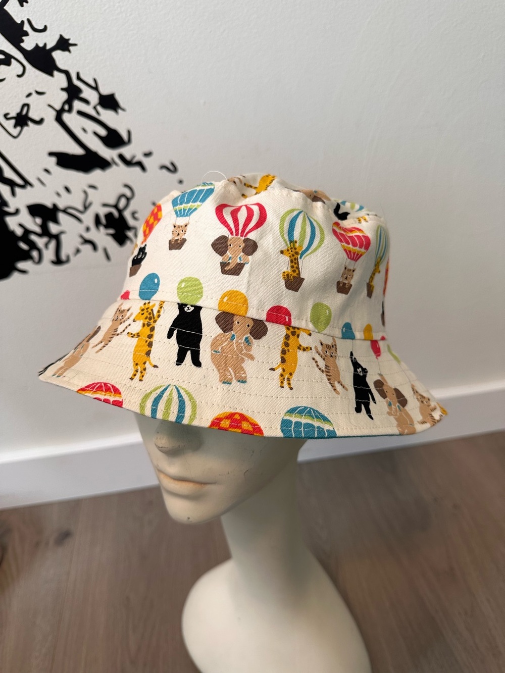 Kids Beige Animal & Hot Air Balloon Bucket Hat and reverse to blue.